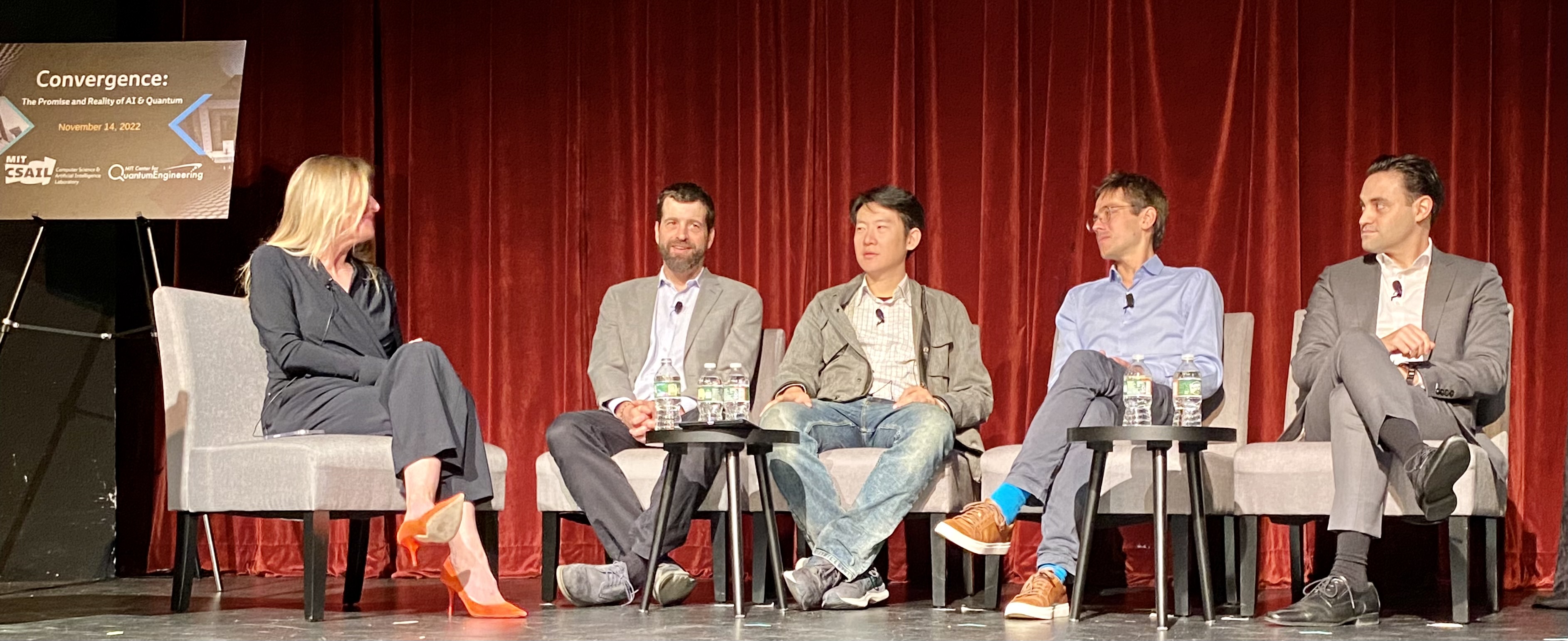 Panelists at "Convergence: The Promise and Reality of AI & Quantum" conference onstage