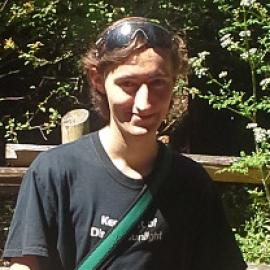 Photo of Michael Coulombe with forest backdrop 